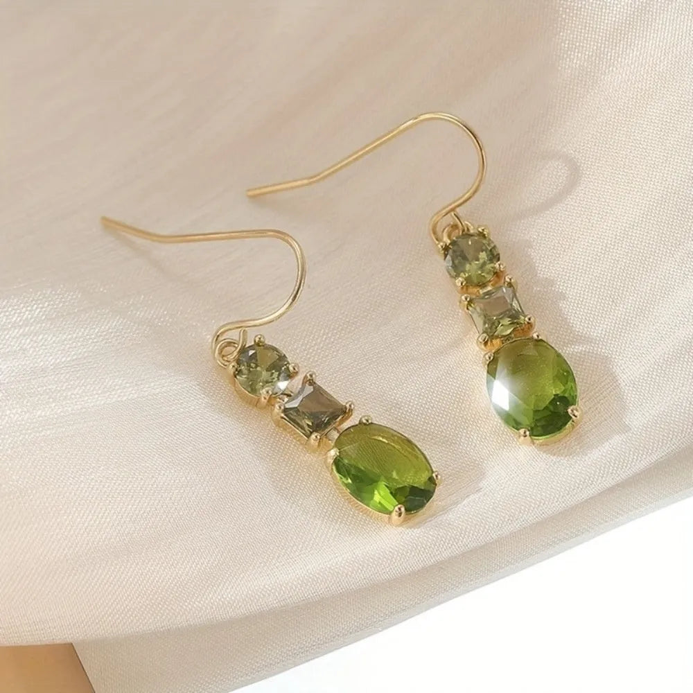 A pair of green geometric copper earrings with a quadrilateral shape in a retro bohemian style.