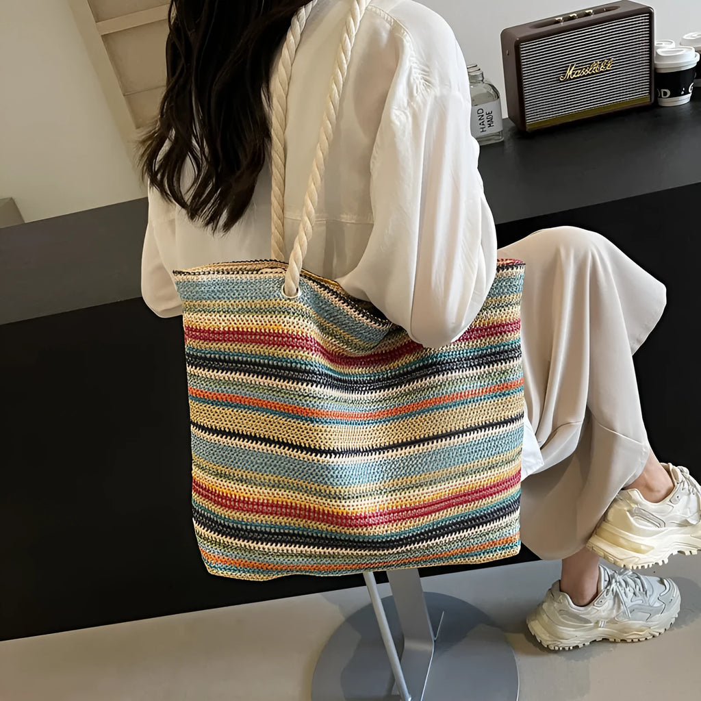 Blue straw woven shoulder bag with nylon construction and polyester lining