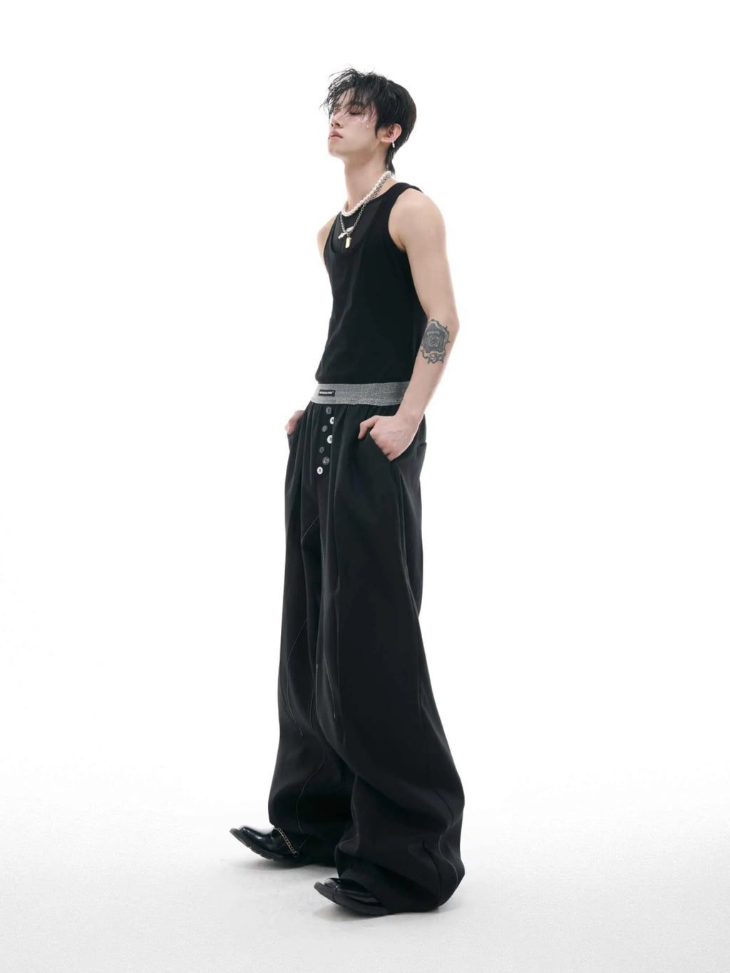 Straight-leg high-waist casual trousers in grey with a button-open line design detail on the leg.
