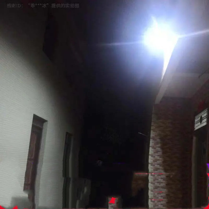 Black solar-powered LED flood light for outdoor and garden use with remote control.