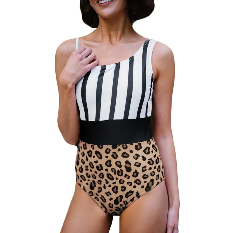 Leopard print women's one-piece swimsuit with high waist and asymmetric collar on a mannequin.