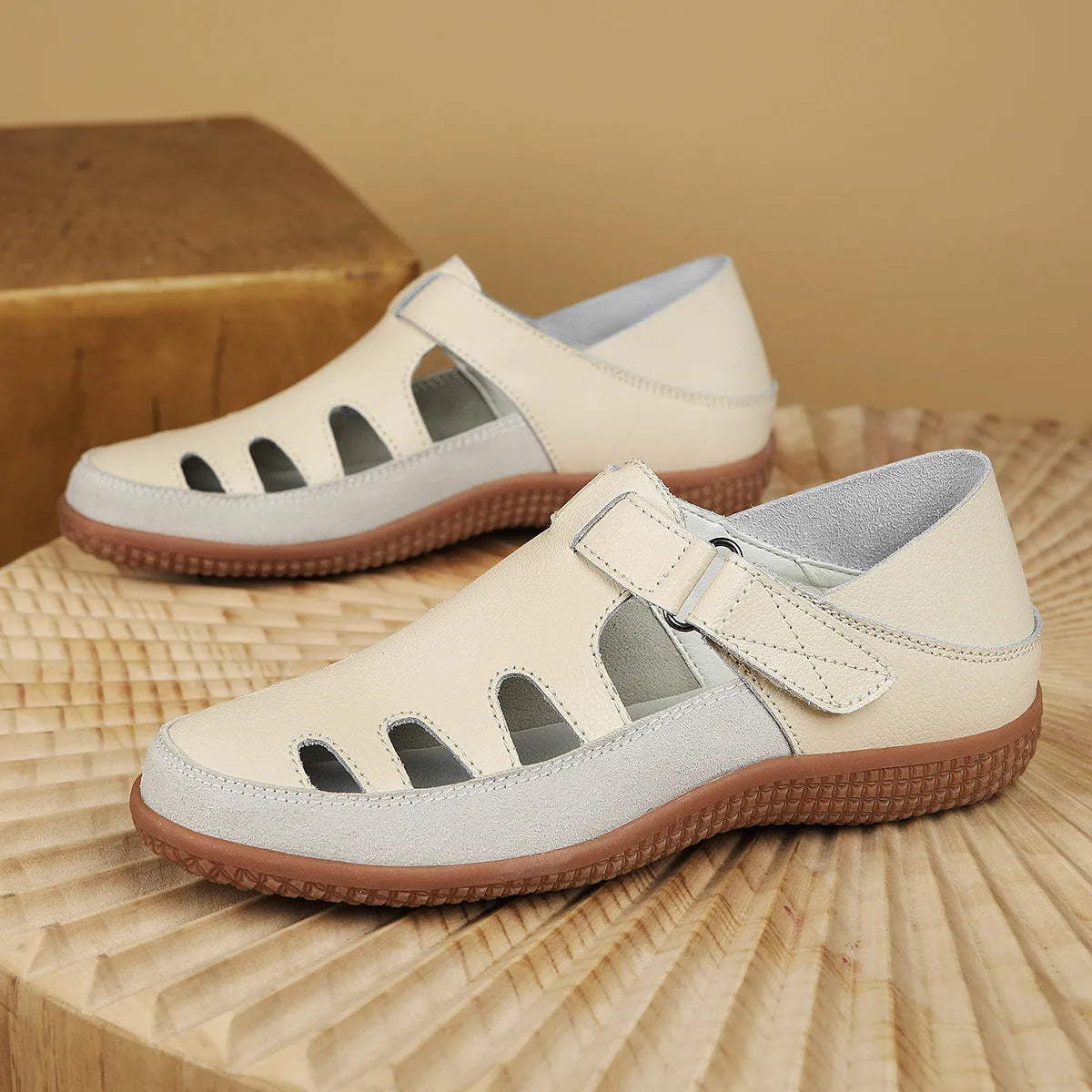 Plus size women's flat sandals in blue with a hollow toe cap and thick rubber sole.
