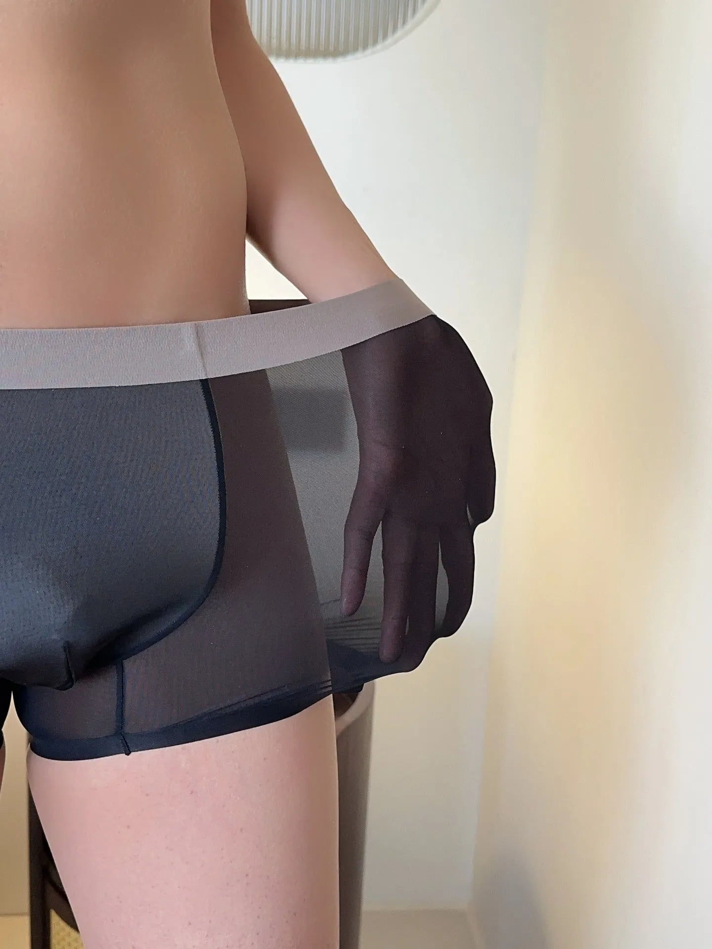 Ultra-thin nude colour men's boxer shorts with seamless design and honeycomb crotch detail.