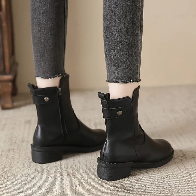 Women's black low heel ankle boots with side zip and round toe design