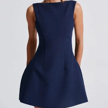 Slim-fitting backless sleeveless summer dress in a solid colour on a hanger, showing high waist and short length.