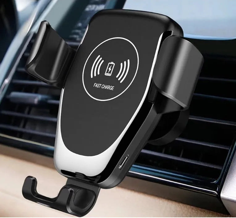 Black car wireless charger mount holding iPhone with automatic clamping arms visible