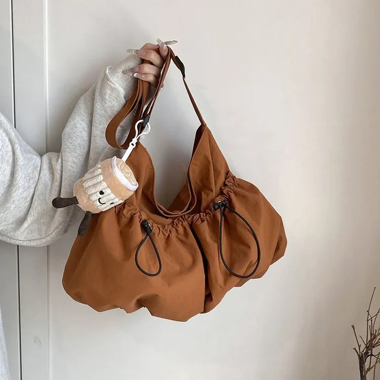 Ultra-light pleated crossbody student bag in soft polyester with split pockets