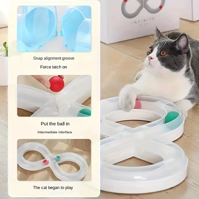 Blue and white cat turntable track ball toy with teasing stick attachment on flat surface