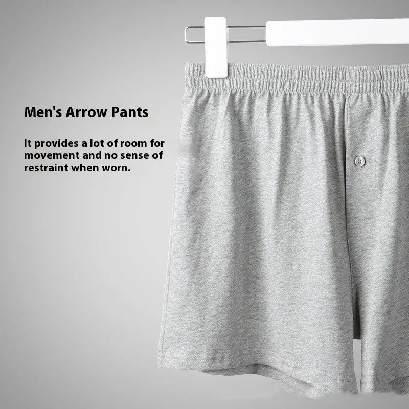 Men's solid colour cotton boxer shorts with a high waist and loose fit on a neutral background.