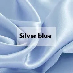 Solid colour silk duvet cover shown in Lotus Pink, laid flat on a bed.