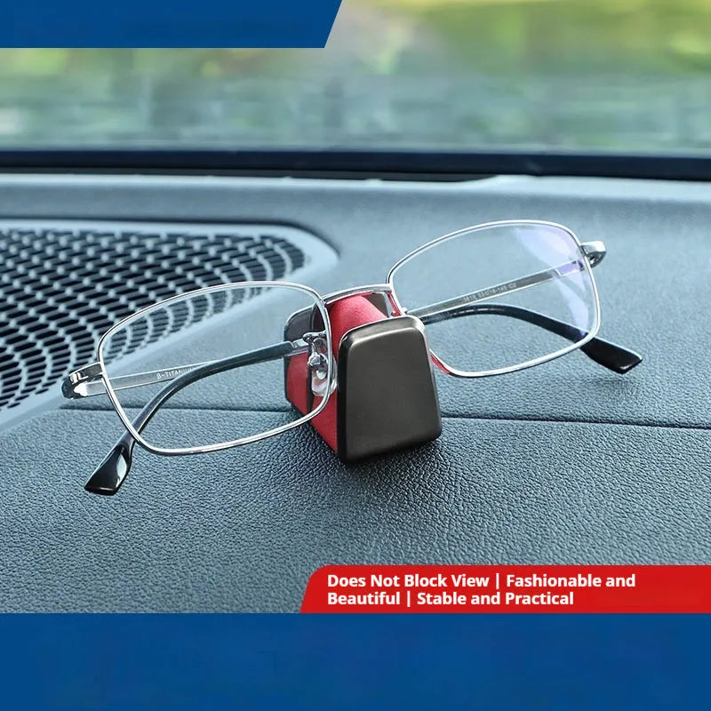 Zinc alloy and leather car dashboard clip for holding glasses, shown in grey.
