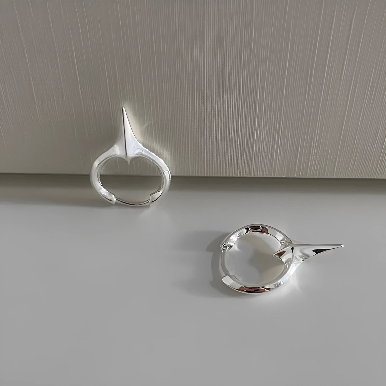 Geometric star-shaped ear clip for women with electroplated copper construction and platinum colour option