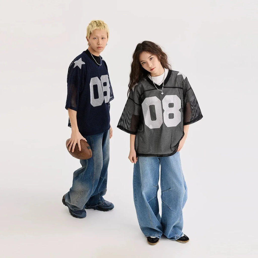 Black polyester pullover shirt with letter pattern design and short sleeves on a hanger