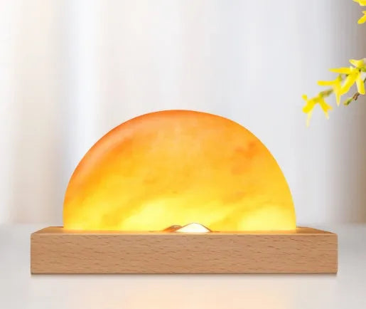 Sunrise Oriental wooden base salt lamp with wireless phone charging pad on top.