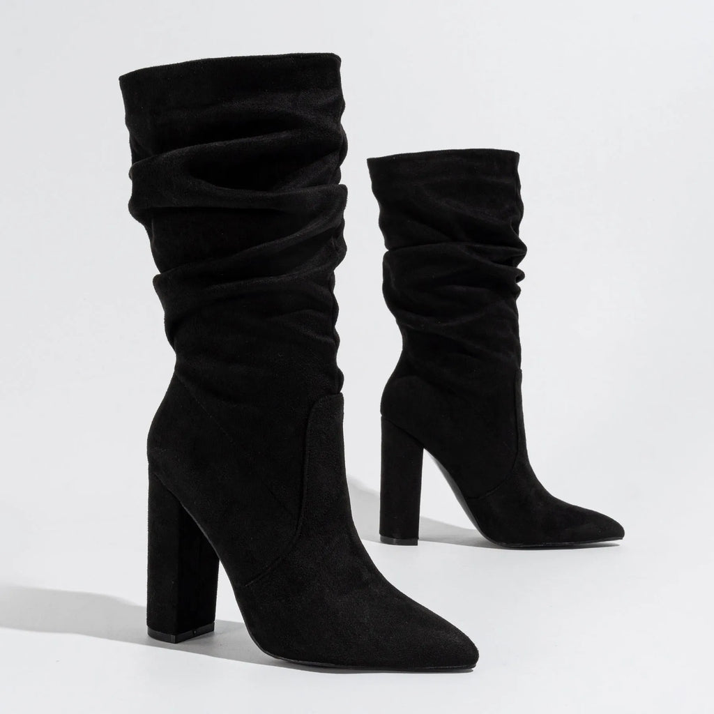 Women's black suede chunky heel boots with pointed toe and mid-calf shaft.