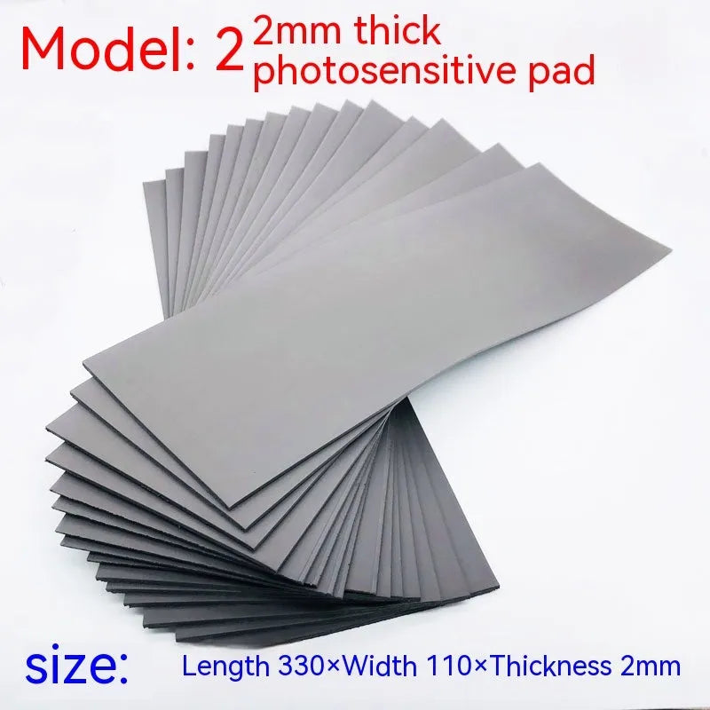 Black and grey plastic light-sensitive mat for calligraphy seal pottery measuring 330 by 110 millimetres