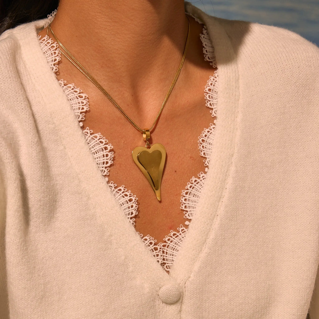 Women's stainless steel necklace with geometric pendant on double heart snake bones chain
