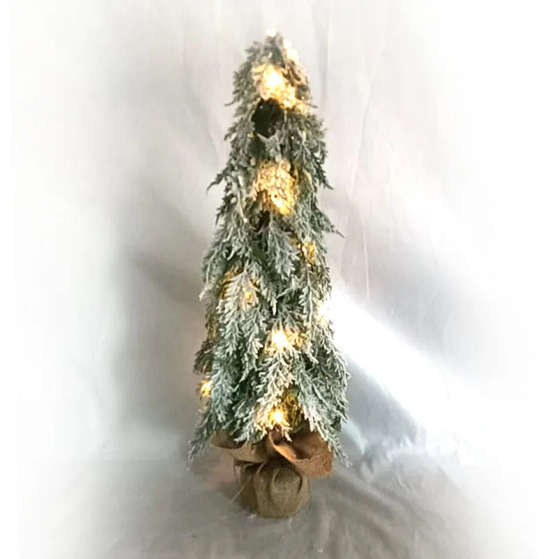 24-inch white snowy plastic desktop Christmas tree with built-in lights and one ornament.