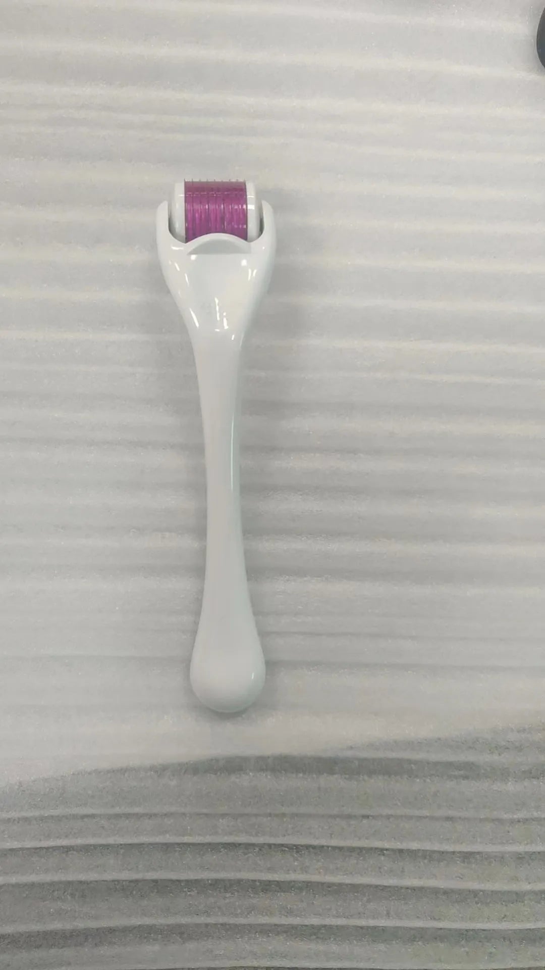 540 needle derma roller micro needling device with black handle and purple roller wheel