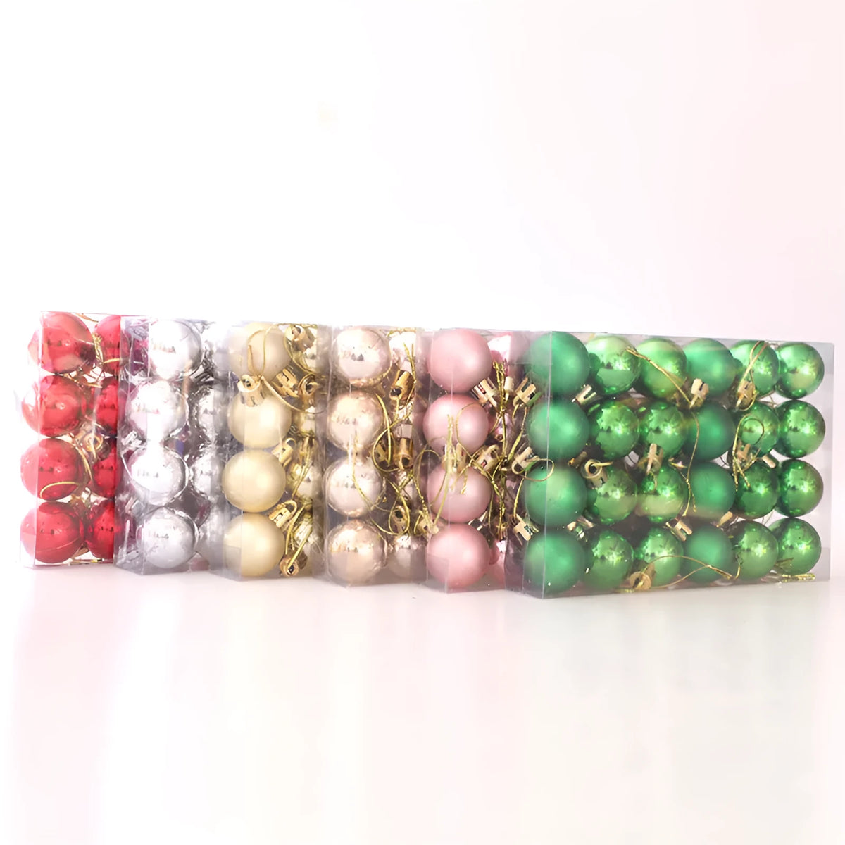 Boxed set of 24 plastic Christmas tree decorations in gold, silver, red, green, champagne gold, and rose gold.