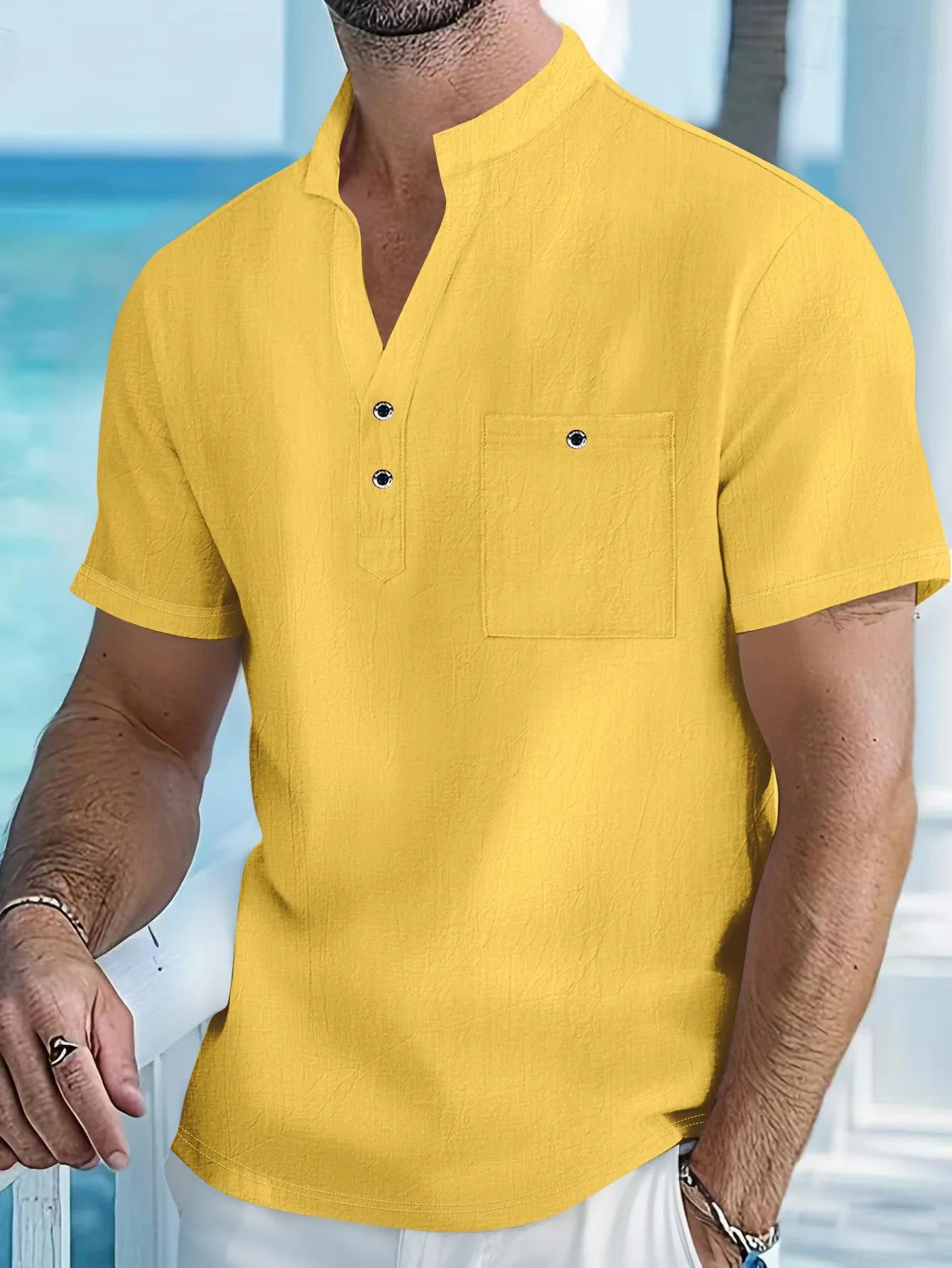 Man's light blue linen blend t-shirt with stand collar and short sleeves in a loose fit.