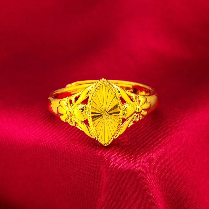 Geometric brass flower ring with gold electroplated finish showing textured diamond design