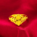 Geometric brass flower ring with gold electroplated finish showing textured diamond design