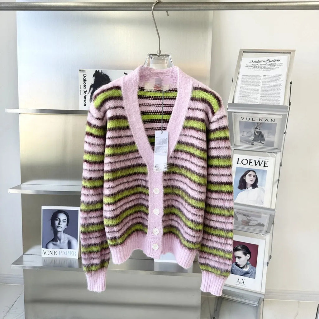 Pink wool lazy coat Haima cardigan sweater with nap craft texture on a hanger.