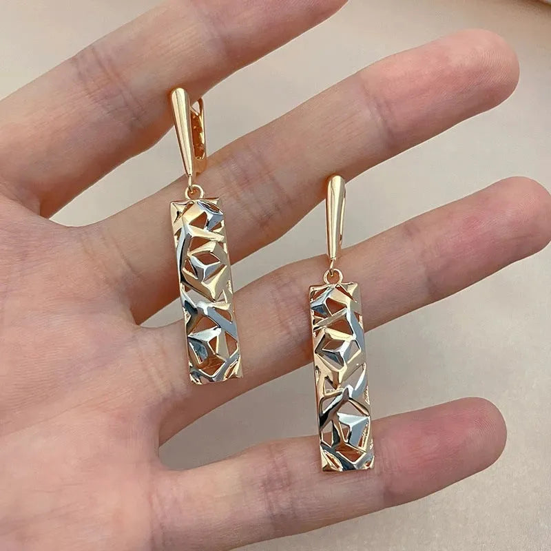 Rectangular two-tone hollow geometric alloy stud earrings for women with electroplated finish.