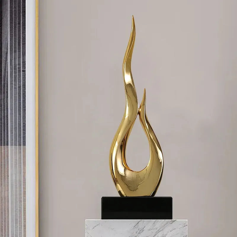 Modern resin festival decoration in bright gold metallic finish with half-handmade construction
