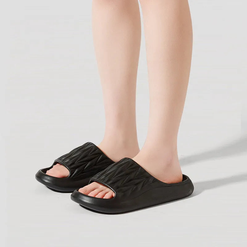 Leaf texture design EVA slippers for men and women in assorted colours on a white background.