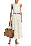White women's sleeveless top and long embroidered skirt retro suit set