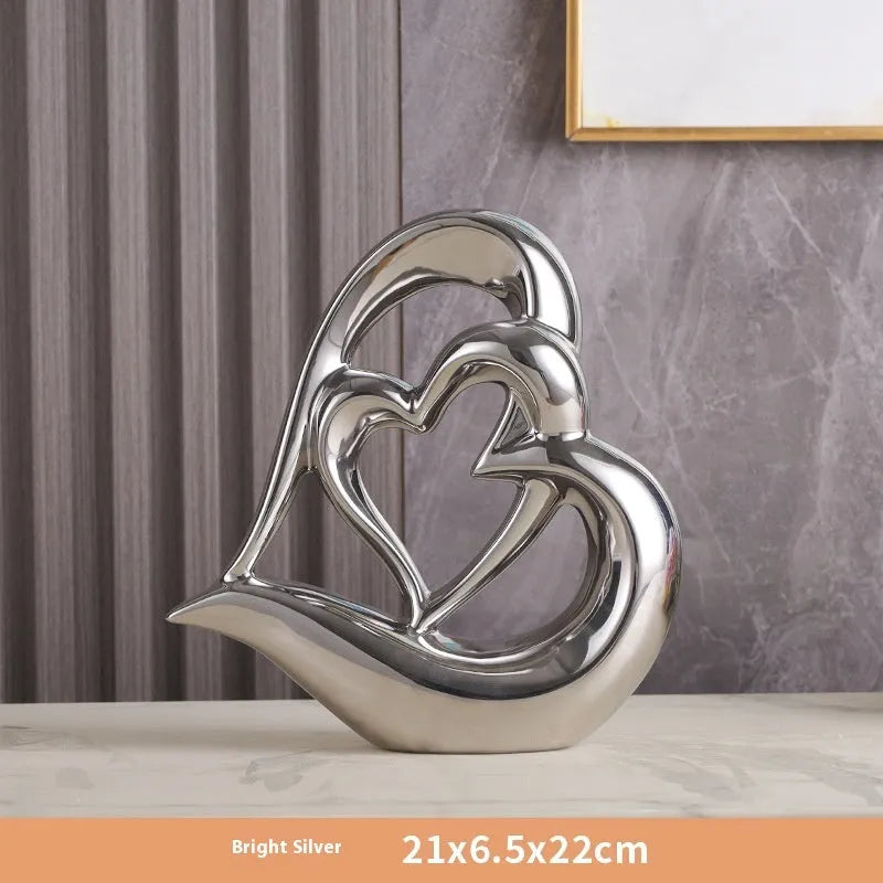 Modern white porcelain love heart ornament with a choice of metallic gold, silver and coloured finishes.