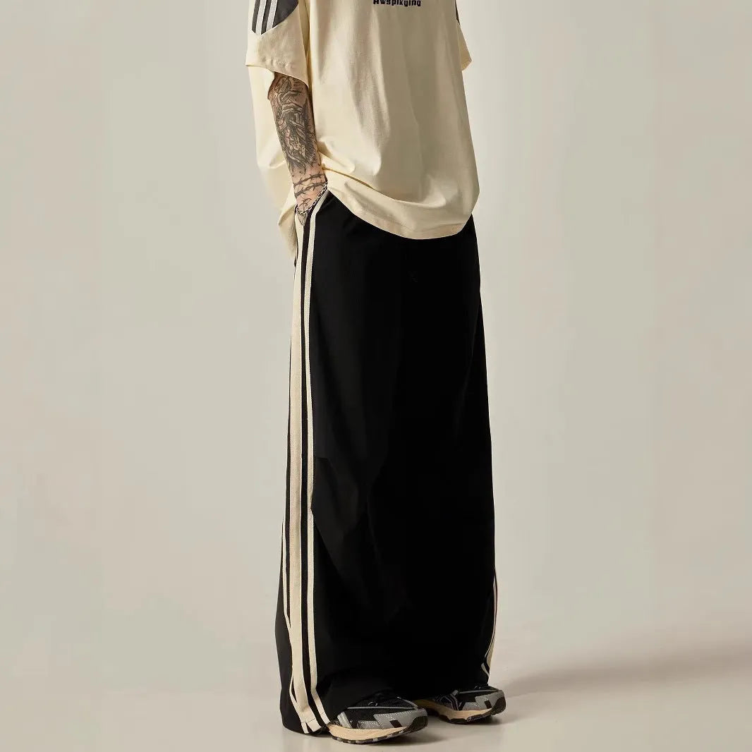 Men's black wide leg climbing trousers with high waist and straight leg design on mannequin
