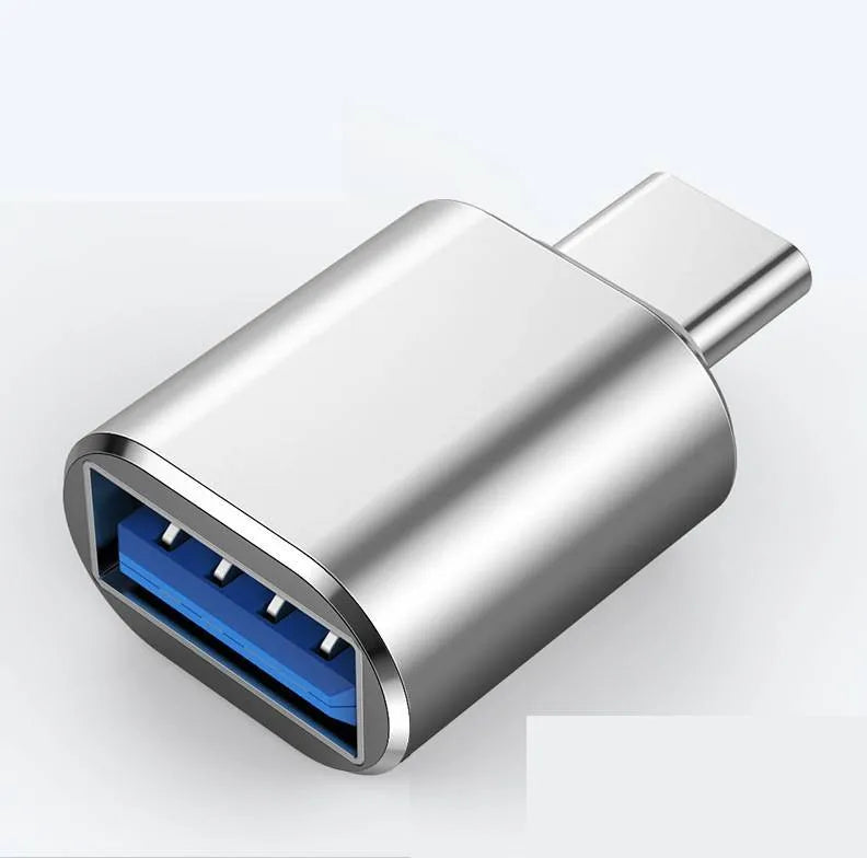 USB-C to dual USB-A OTG adapter in brushed aluminium, showing black, gold, and silver colour options.