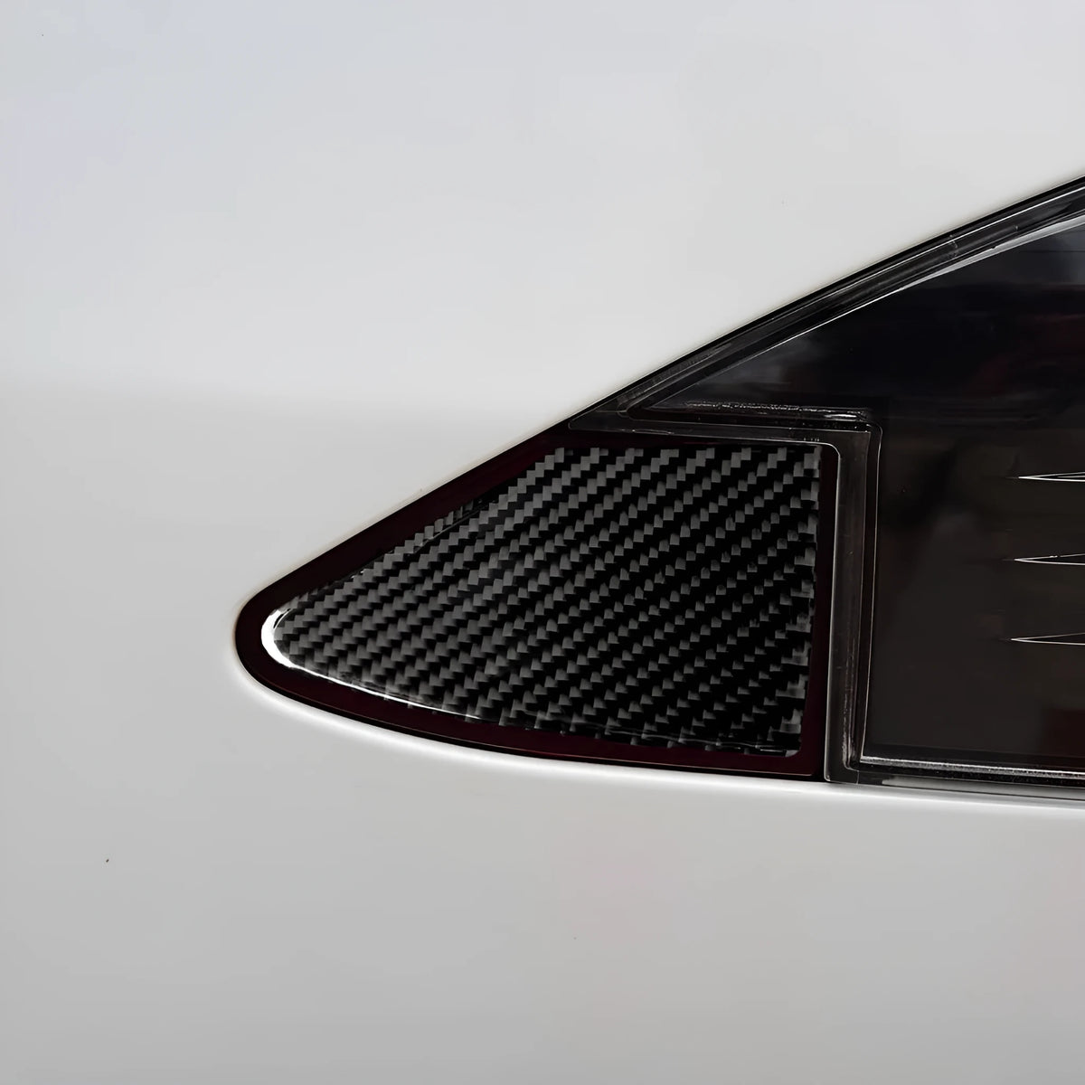 Square carbon fibre decorative sticker for car USB charging port panel with 3M adhesive backing.