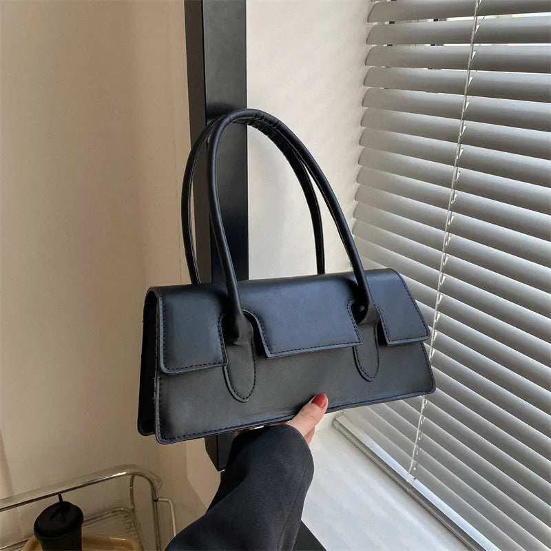 Women's small square shoulder bag in PU leather with stitching detail, shown in yellow colour