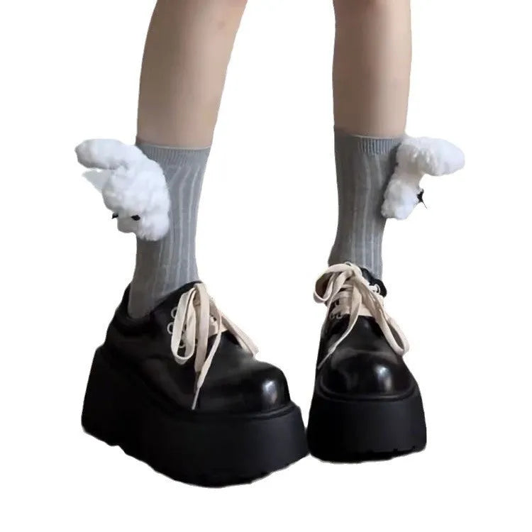 Women's matte black retro ankle boots with a thick rubber sole and buckle fastening on the side.