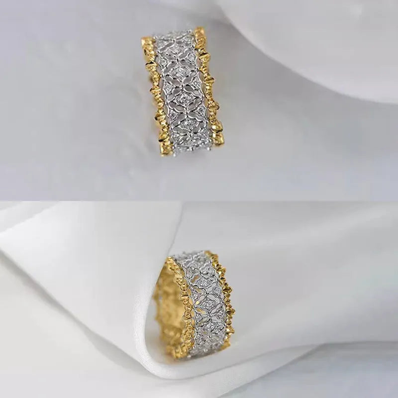 Geometric gold two-tone women's ring with round cubic zirconia stone on copper base.