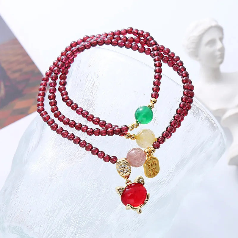 Purplish red garnet fox charm bracelet with adjustable rope closure for women