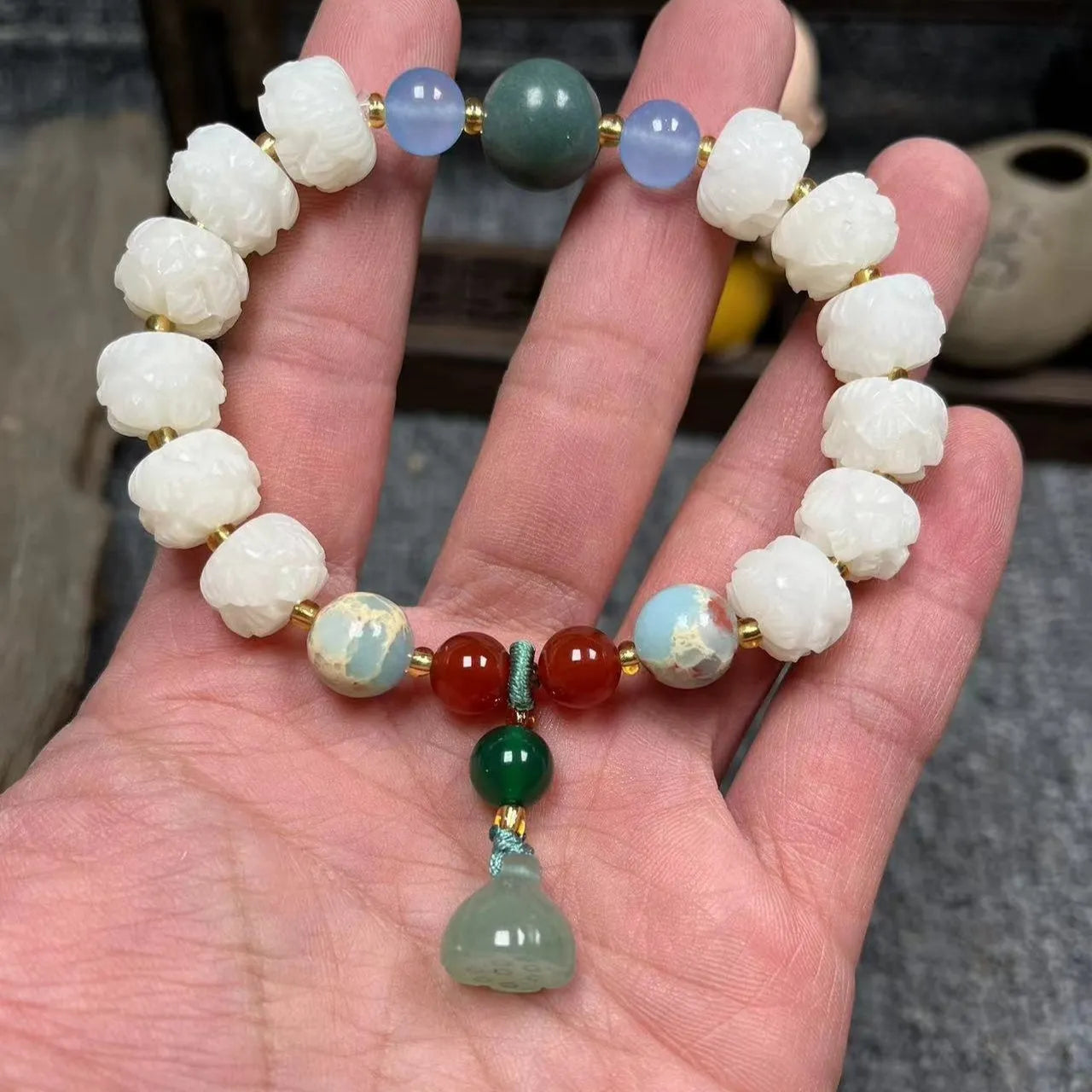 Carved bodhi root pumpkin lotus bracelet with white jade beads and mixed sizing