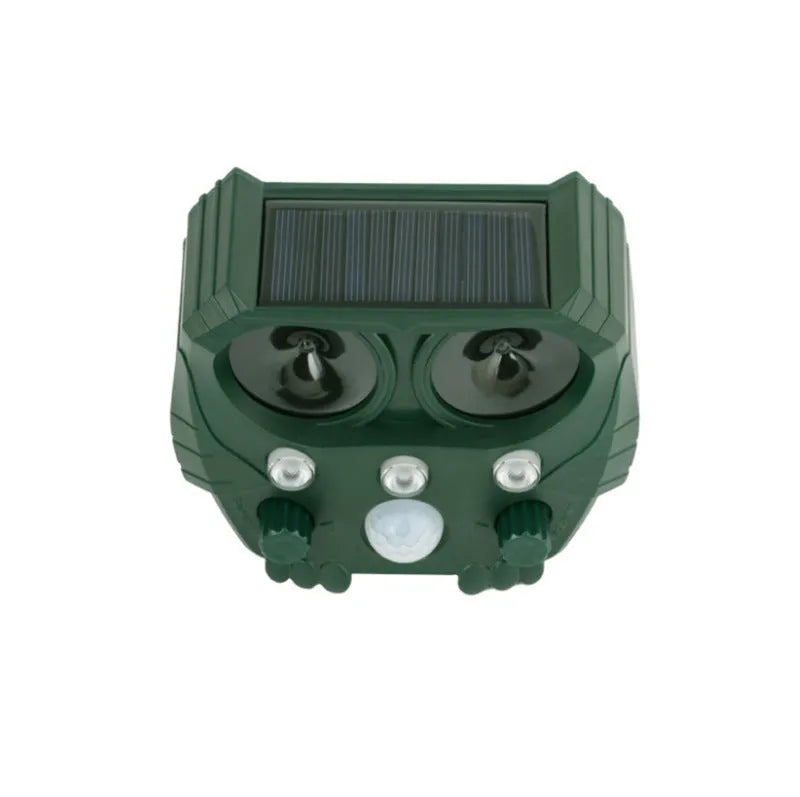 Green solar-powered ultrasonic animal repeller unit with solar panel on top