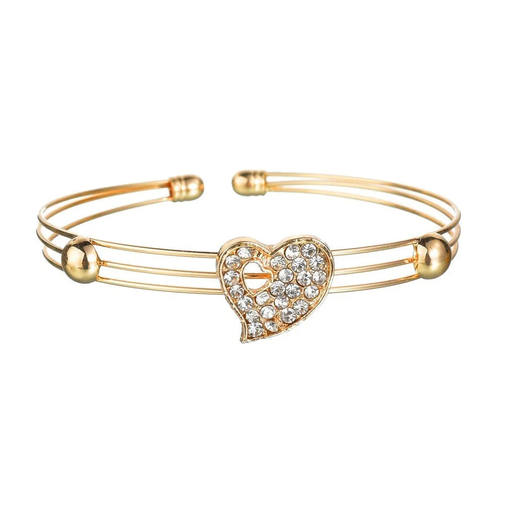 Women's gold-colour alloy jewellery set with heart, water drop and bell pendants including earrings and adjustable decorations