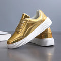 Thick-soled sequin platform sneakers in metallic gold colour with round toe