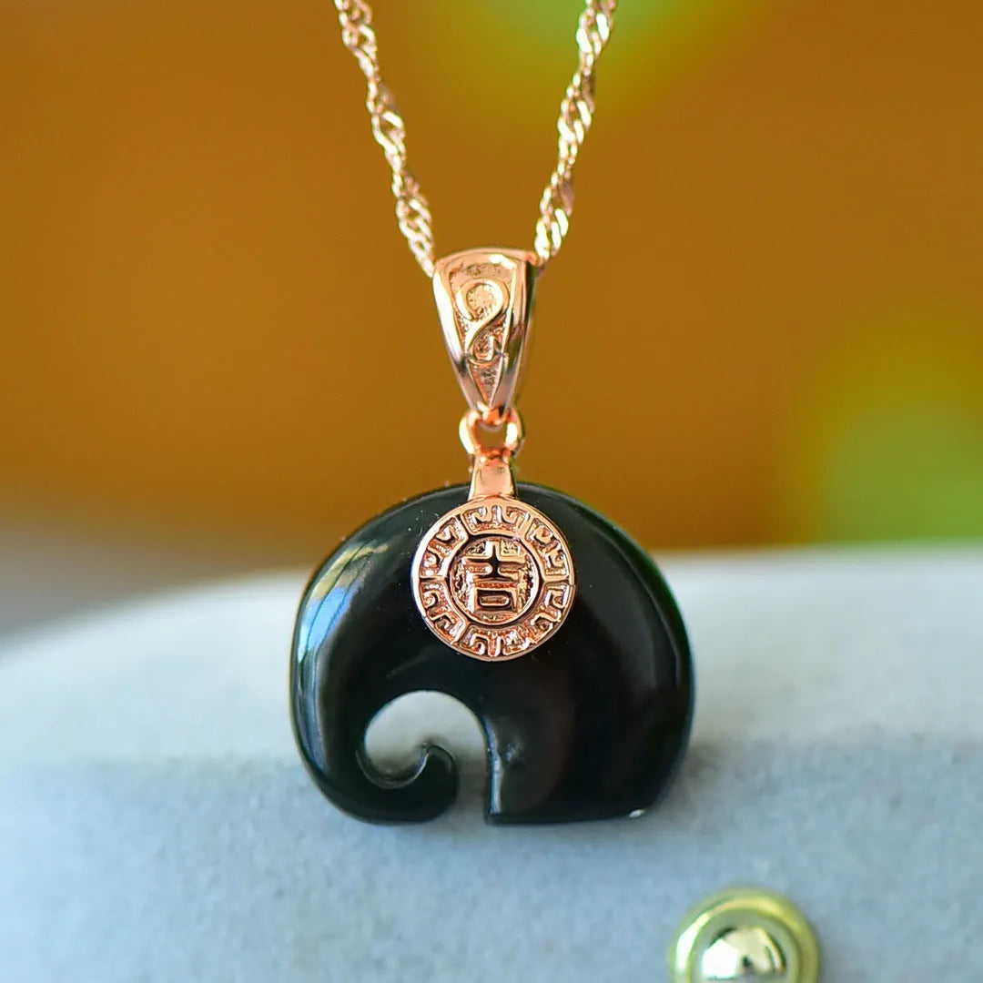 Modern natural Hetian grey jade pendant with copper inlay and ink-blue jade accents on a necklace chain.