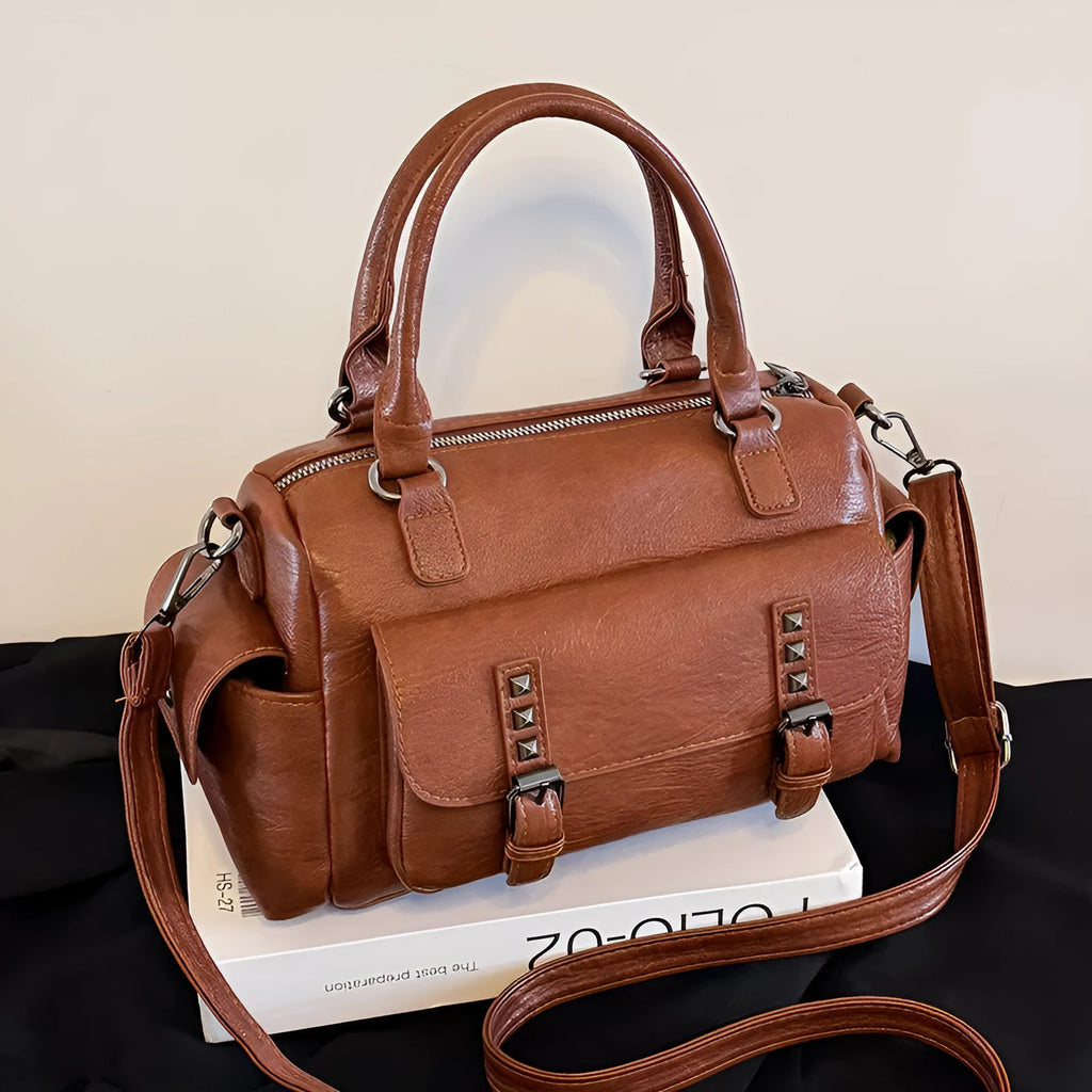 Vintage messenger bag in horizontal square shape with contrast stitching, shown in available colours