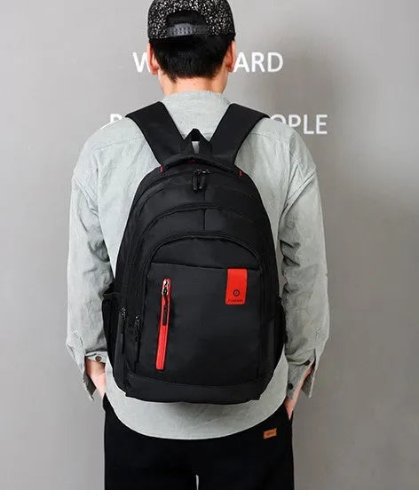 Oxford fabric backpack for teens with breathable padded straps and side zipper pockets in blue