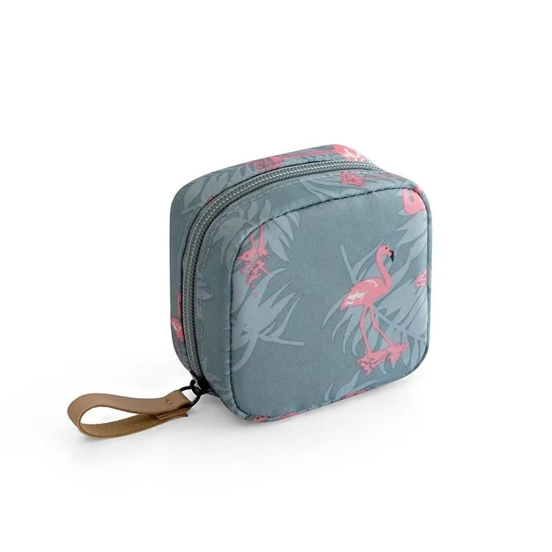 A blue cube-shaped cloth makeup storage bag for organising cosmetics and brushes.