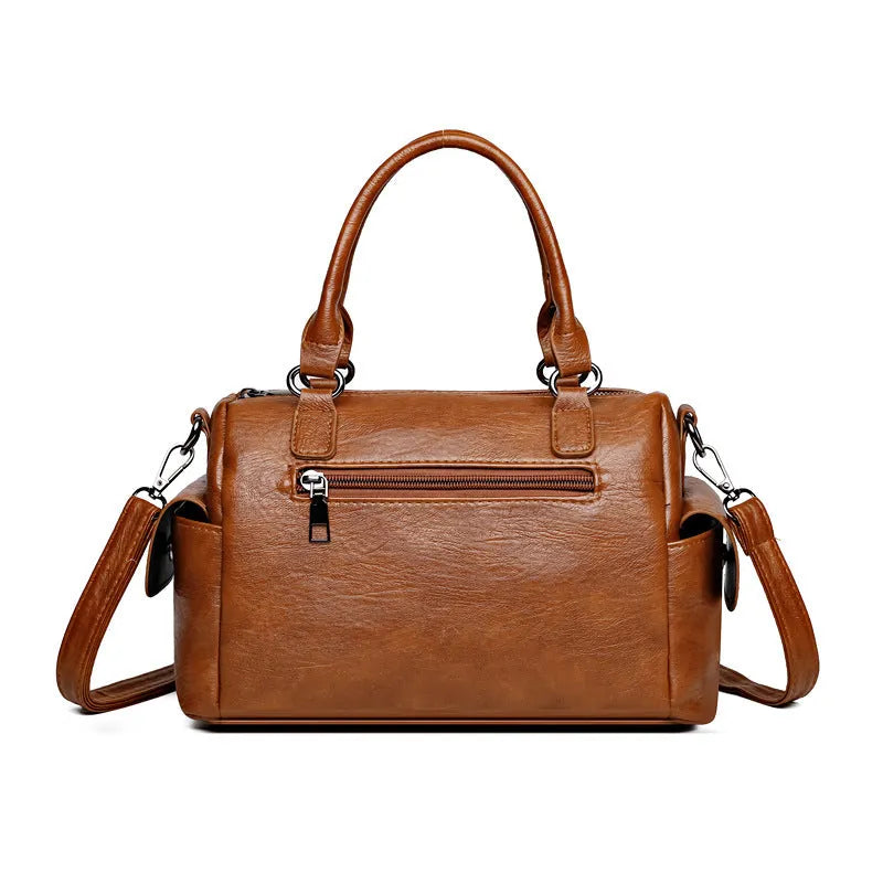 Vintage messenger bag in horizontal square shape with contrast stitching, shown in available colours