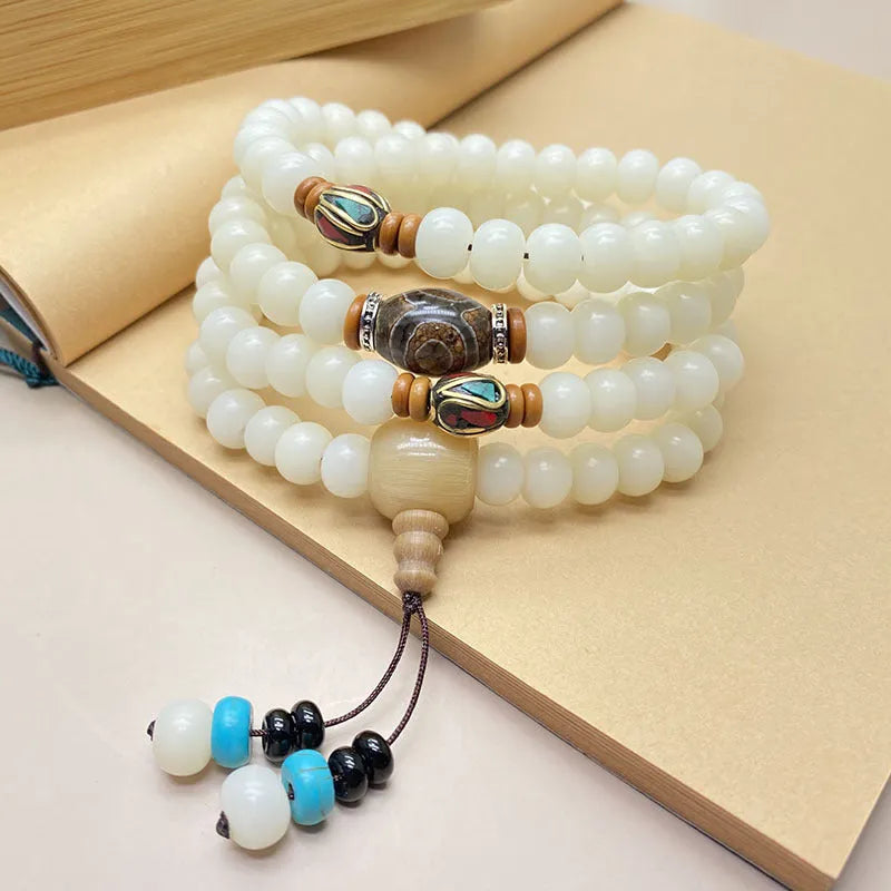 White Jade Bodhi 108-bead bracelet showing bead detail, offered in different styles and sizes.